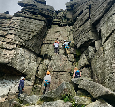 Group climbing at stanage edge