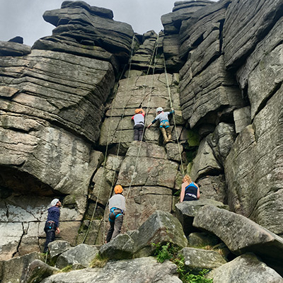 Group climbing at stanage edge